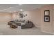 Finished basement featuring a cozy seating area with a sectional sofa and coffee table at 9885 Oakleaf Way, McCordsville, IN 46055