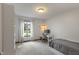 Minimalist bedroom with a desk, soft carpet, and natural light, providing a serene and functional space at 9885 Oakleaf Way, McCordsville, IN 46055