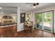 Cozy dining area with a sliding glass door to the outdoor deck, adjacent to the living room at 9885 Oakleaf Way, McCordsville, IN 46055
