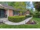 Inviting front entrance with a brick facade, a charming walkway, and manicured landscaping at 9885 Oakleaf Way, McCordsville, IN 46055