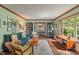 Stylish living room showcasing hardwood floors, a comfortable blue sofa, and custom built-in bookshelves at 9885 Oakleaf Way, McCordsville, IN 46055