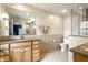 Bright bathroom featuring a large vanity with granite countertop and tile flooring at 100 Wellington Rd, Indianapolis, IN 46260