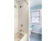 Cozy bathroom featuring white tiled walls and a combined shower and tub at 100 Wellington Rd, Indianapolis, IN 46260