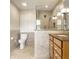 Updated bathroom featuring a frameless shower and tile accents at 100 Wellington Rd, Indianapolis, IN 46260