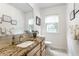 Bathroom featuring a large mirror, vanity with granite countertop, and a window for natural light at 100 Wellington Rd, Indianapolis, IN 46260