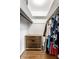 Walk-in closet with built-in drawers and custom closet shelving at 100 Wellington Rd, Indianapolis, IN 46260