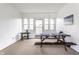 Bright dining room featuring wainscoting and a picnic table for a rustic, casual dining experience at 100 Wellington Rd, Indianapolis, IN 46260