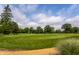 Scenic view of a lush green golf course on a clear day at 100 Wellington Rd, Indianapolis, IN 46260