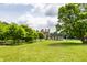 Picturesque park with ruins, lush greenery, and towering trees at 100 Wellington Rd, Indianapolis, IN 46260