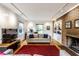 Cozy living room with a brick fireplace, built-in shelves, comfortable seating, and natural light at 100 Wellington Rd, Indianapolis, IN 46260
