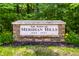 Stone entrance sign for 'The Town of Meridian Hills est. 1937' at 100 Wellington Rd, Indianapolis, IN 46260