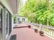 Spacious back deck with lush greenery, perfect for outdoor relaxation and entertainment at 10350 Courageous Dr, Indianapolis, IN 46236