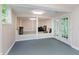 Partially finished basement with versatile space, bright natural light, and outdoor access at 10350 Courageous Dr, Indianapolis, IN 46236