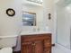 Bathroom featuring a vanity with a framed mirror, decorative accents, and a glass-enclosed shower at 10350 Courageous Dr, Indianapolis, IN 46236