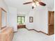 Inviting bedroom with a window seat, light neutral walls, and a wood-toned dresser at 10350 Courageous Dr, Indianapolis, IN 46236