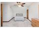 Cozy bedroom with a ceiling fan, a queen-sized bed and neutral carpet at 10350 Courageous Dr, Indianapolis, IN 46236