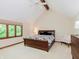Cozy bedroom features a vaulted ceiling, a bed with floral bedding, and a large window at 10350 Courageous Dr, Indianapolis, IN 46236