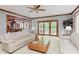 Cozy living room with a ceiling fan and sliding glass doors to the patio at 10350 Courageous Dr, Indianapolis, IN 46236