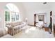 Bright living room with vaulted ceilings and large windows providing natural light at 10350 Courageous Dr, Indianapolis, IN 46236