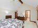 Spacious main bedroom featuring hardwood furniture, a king-size bed and a view of the en-suite bathroom at 10350 Courageous Dr, Indianapolis, IN 46236