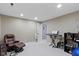 Spacious finished basement featuring recessed lighting, a large chair, and musical equipment at 11872 Traymoore Dr, Fishers, IN 46038