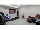 A cozy basement rec room includes a recliner, guitar, and musical instruments at 11872 Traymoore Dr, Fishers, IN 46038