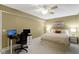 Bedroom features a bed, a desk with two computer monitors, and neutral décor, creating a functional space at 11872 Traymoore Dr, Fishers, IN 46038