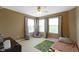 Bedroom with three large windows, a cozy rug, and a soft-toned color palette at 11872 Traymoore Dr, Fishers, IN 46038