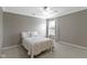 Neutral bedroom features a queen bed, natural light, and minimalist decor for a peaceful ambiance at 11872 Traymoore Dr, Fishers, IN 46038