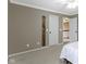 Neutral bedroom featuring a queen bed, natural light, and minimalist decor for a peaceful ambiance at 11872 Traymoore Dr, Fishers, IN 46038