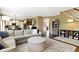 Spacious living room with a modern decor, open concept, fireplace and hardwood floors at 11872 Traymoore Dr, Fishers, IN 46038