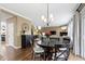 Open concept living area with hardwood floors, fireplace, and access to the stairway at 11872 Traymoore Dr, Fishers, IN 46038