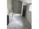 Updated bathroom featuring modern fixtures, a tiled shower/tub, and stylish marble tile flooring at 1322 S Belmont Ave, Indianapolis, IN 46221