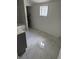 Bathroom with tub and modern fixtures, complemented by elegant marble tile flooring at 1322 S Belmont Ave, Indianapolis, IN 46221