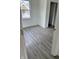 Bedroom with grey flooring, a window for natural light and fresh paint at 1322 S Belmont Ave, Indianapolis, IN 46221