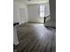 Bright living room with wood floors, natural light, and modern finishes at 1322 S Belmont Ave, Indianapolis, IN 46221