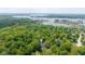 Aerial view of the property, showing proximity to Geist Marina and a densely wooded area at 13300 Fairwood Dr, McCordsville, IN 46055
