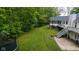 Expansive backyard featuring a lush lawn and wooded surroundings at 13300 Fairwood Dr, McCordsville, IN 46055