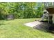 Expansive backyard with lush green lawn, patio, and trampoline, ideal for outdoor enjoyment at 13300 Fairwood Dr, McCordsville, IN 46055