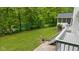 Beautiful backyard view with an expansive yard, deck, and mature trees at 13300 Fairwood Dr, McCordsville, IN 46055