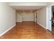 Bright basement with hardwood floors, neutral walls, and access to upper level, perfect for entertaining at 13300 Fairwood Dr, McCordsville, IN 46055