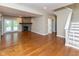 Spacious finished basement features a stone fireplace, wood flooring, and access to the backyard at 13300 Fairwood Dr, McCordsville, IN 46055