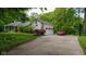 Exterior view of house featuring a garage, basketball hoop, and well-manicured lawn at 13300 Fairwood Dr, McCordsville, IN 46055
