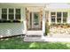 Inviting front entrance with stone accents and decorative windows at 13300 Fairwood Dr, McCordsville, IN 46055