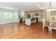 Open concept kitchen with stainless steel appliances, island, and eat-in area at 13300 Fairwood Dr, McCordsville, IN 46055