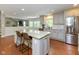 Spacious eat-in kitchen with granite island, stainless steel appliances and an open floor plan at 13300 Fairwood Dr, McCordsville, IN 46055