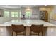 Kitchen features a large island with granite countertops and seating at 13300 Fairwood Dr, McCordsville, IN 46055