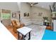 Bright and comfortable living room features vaulted ceilings, fireplace, and large windows at 13300 Fairwood Dr, McCordsville, IN 46055