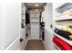 A walk-in closet with custom shelving and drawers provides ample storage space at 13300 Fairwood Dr, McCordsville, IN 46055