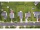 Aerial view showcasing the neighborhood with large grassy yards, mature trees, and neat landscaping at 1431 Evergreen Dr, Greenfield, IN 46140
